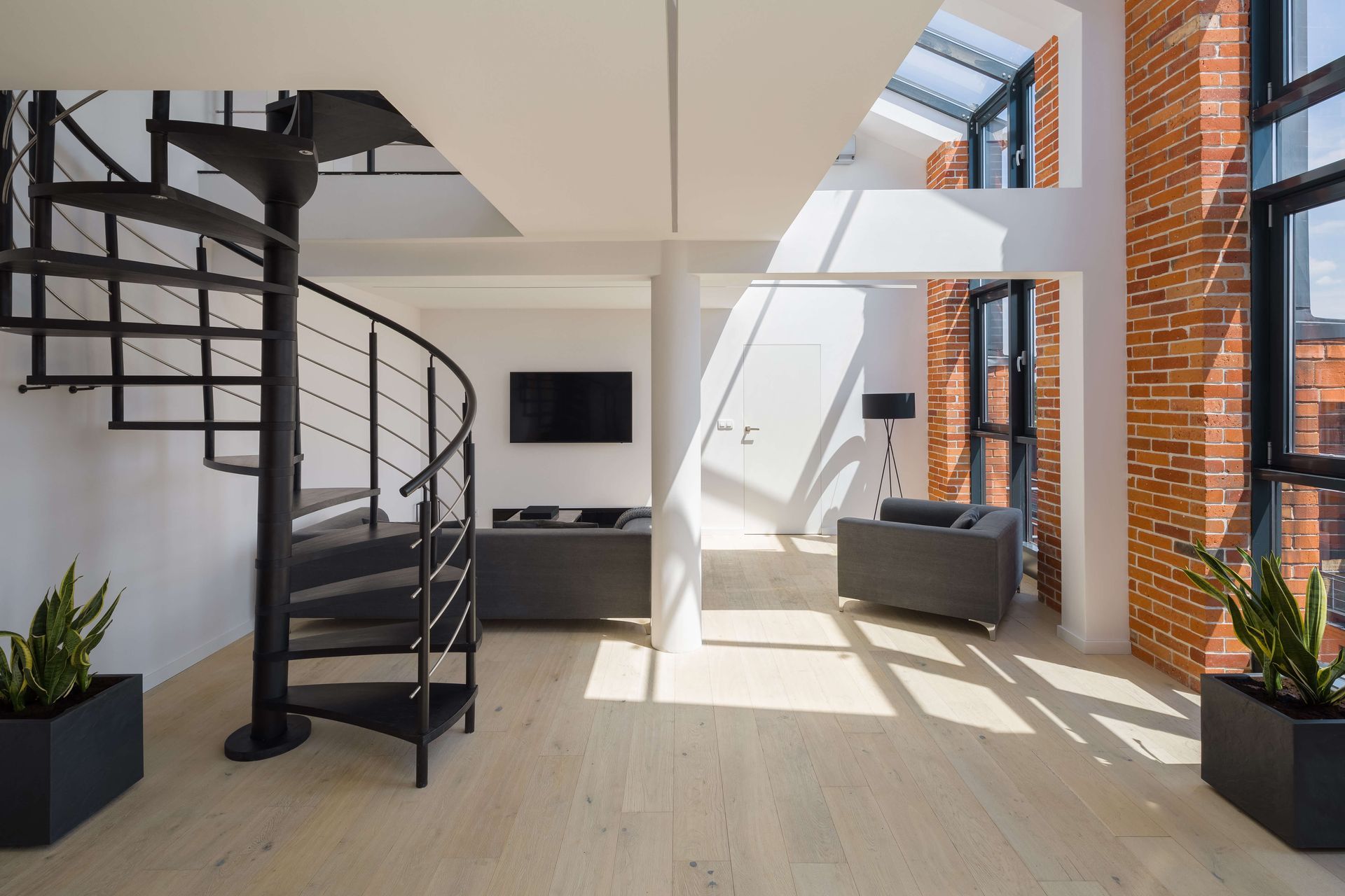 There is a spiral staircase in the middle of the room.