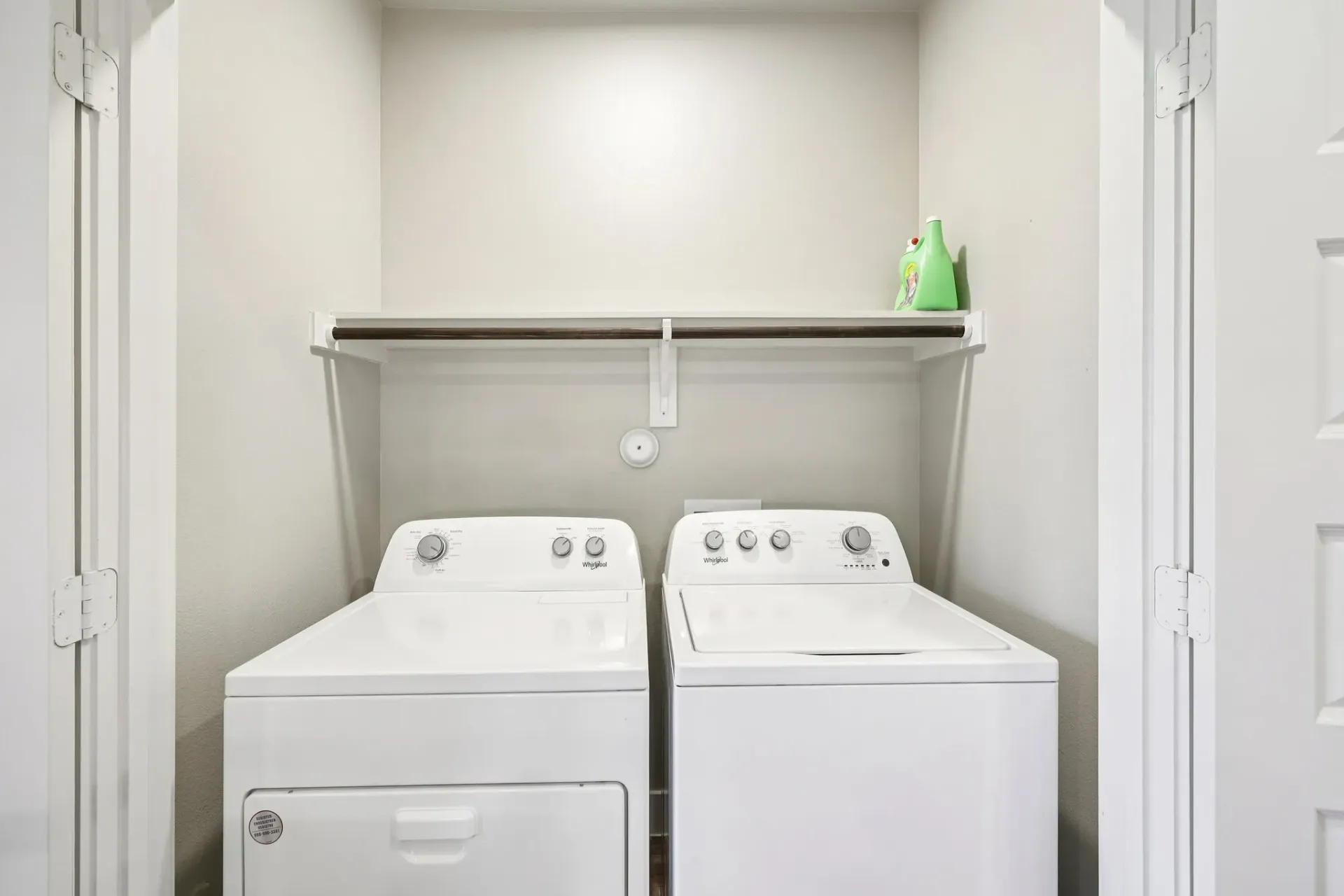 Washer and dryer in a laundry closet.