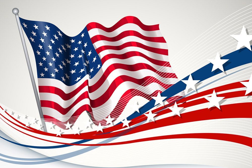 American flag waving with red, white, and blue ribbons and white stars.