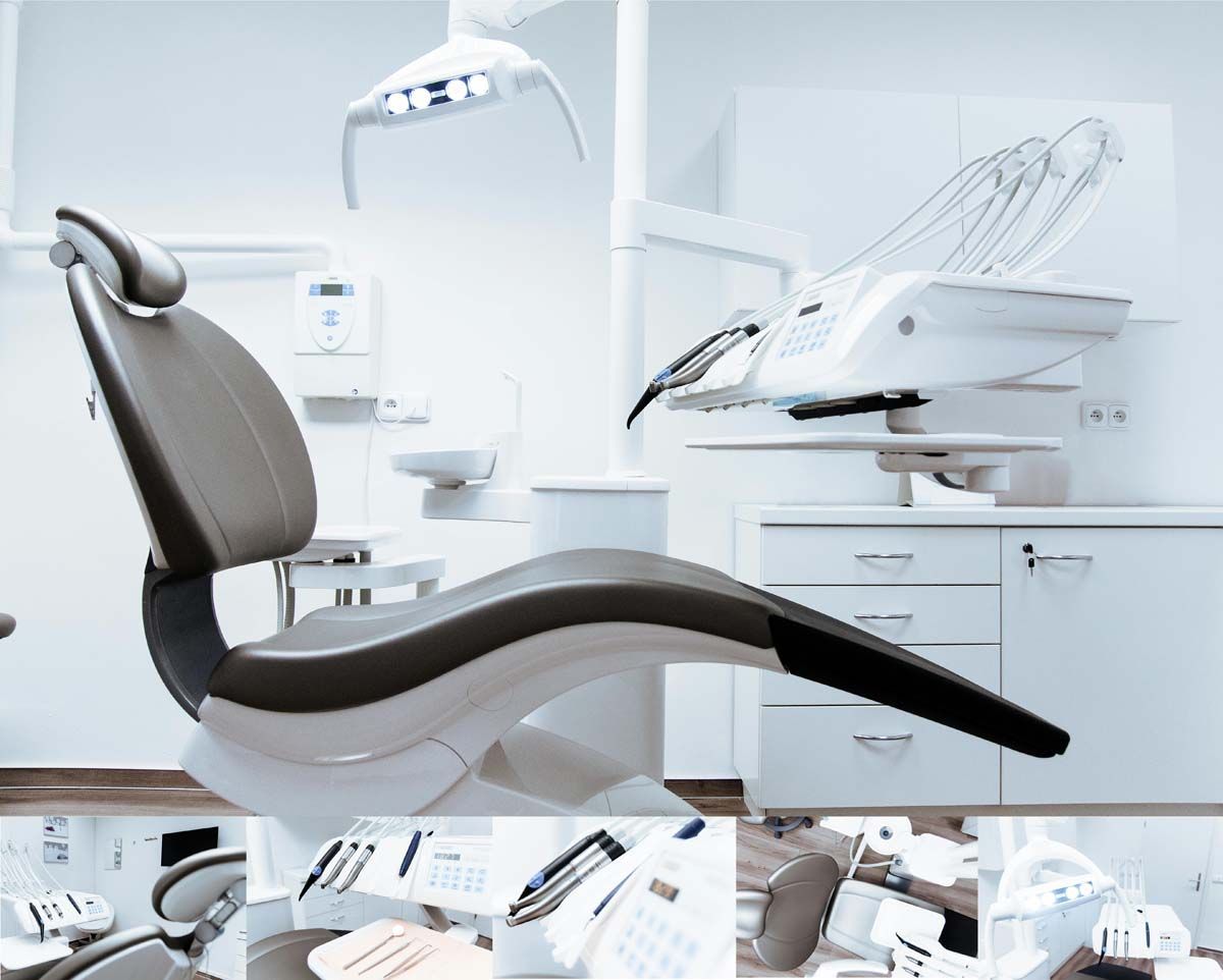 Dental chair and equipment in a sterile, white examination room.