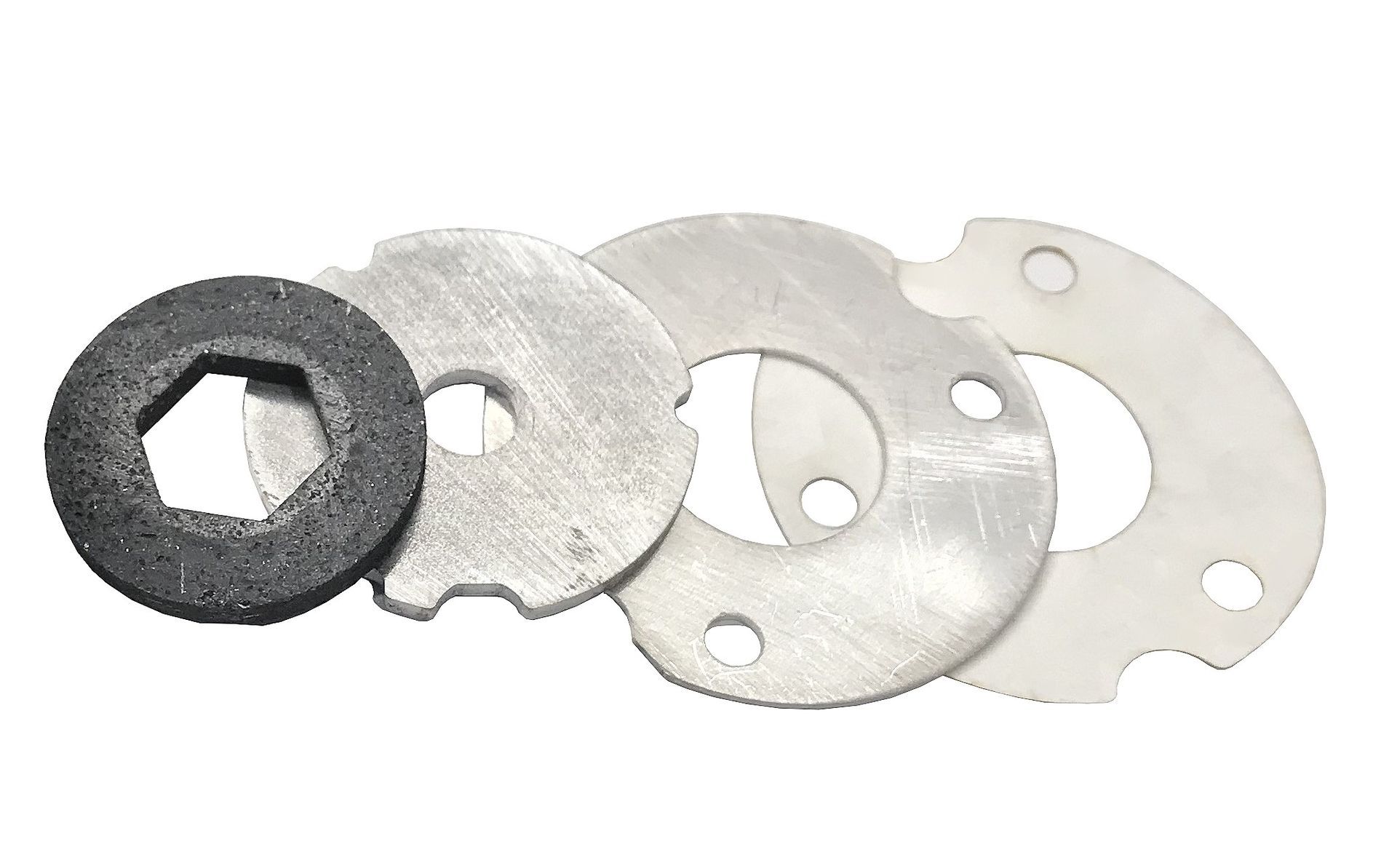 Assorted metal and foam washers or gaskets arranged in a row on a white background