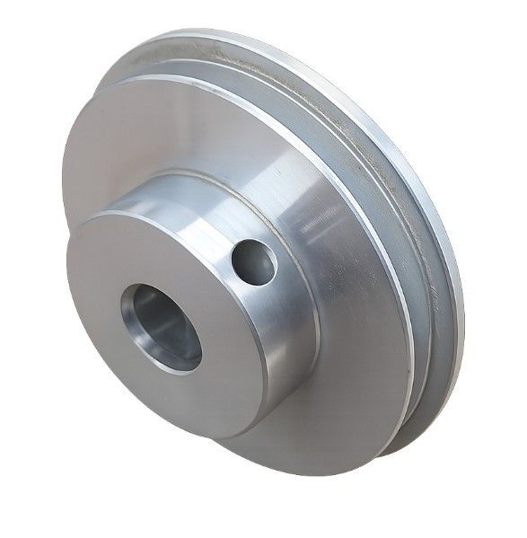 Silver metal pulley wheel with a central bore and side hole on a white background