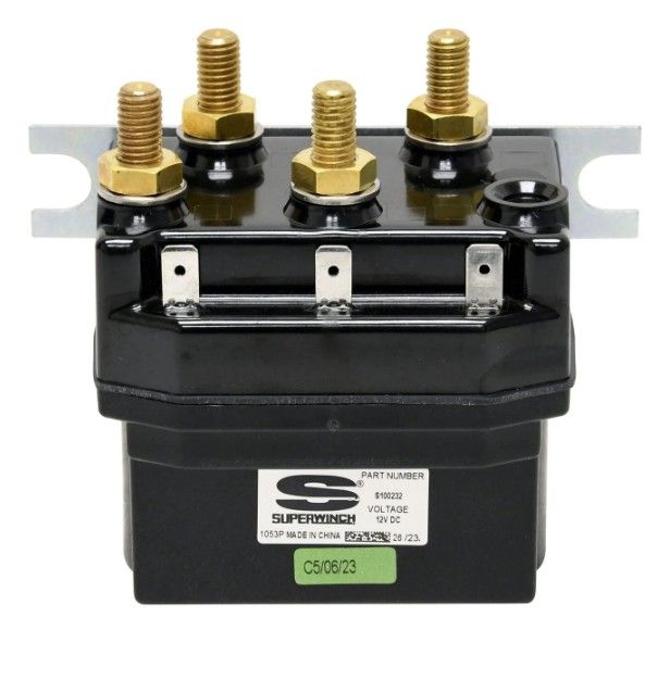Black electrical battery/relay unit with four brass terminals and a label on the front