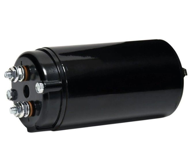 Black cylindrical electrical capacitor with two metal terminals on one end