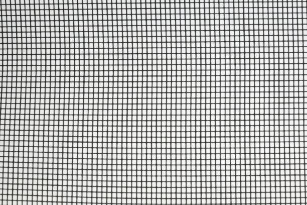 A close up of a screen door with a grid pattern.