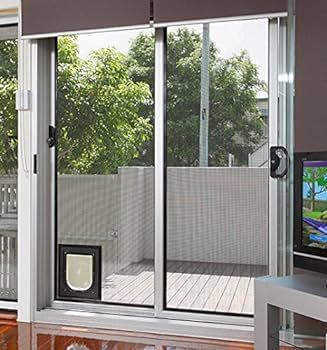 A living room with a sliding glass door and a television.