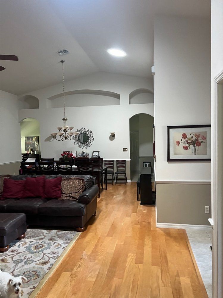 A living room with hardwood floors and a couch