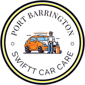 Shop owner seated at desk with certifications visible, wearing Swiftt Car Care branded t-shirt