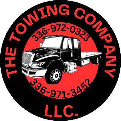 The logo for the Towing Company LLC shows a black truck