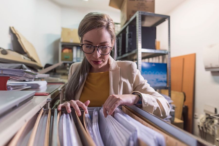 Staffing coordinator reviewing workforce plans in a modern workplace