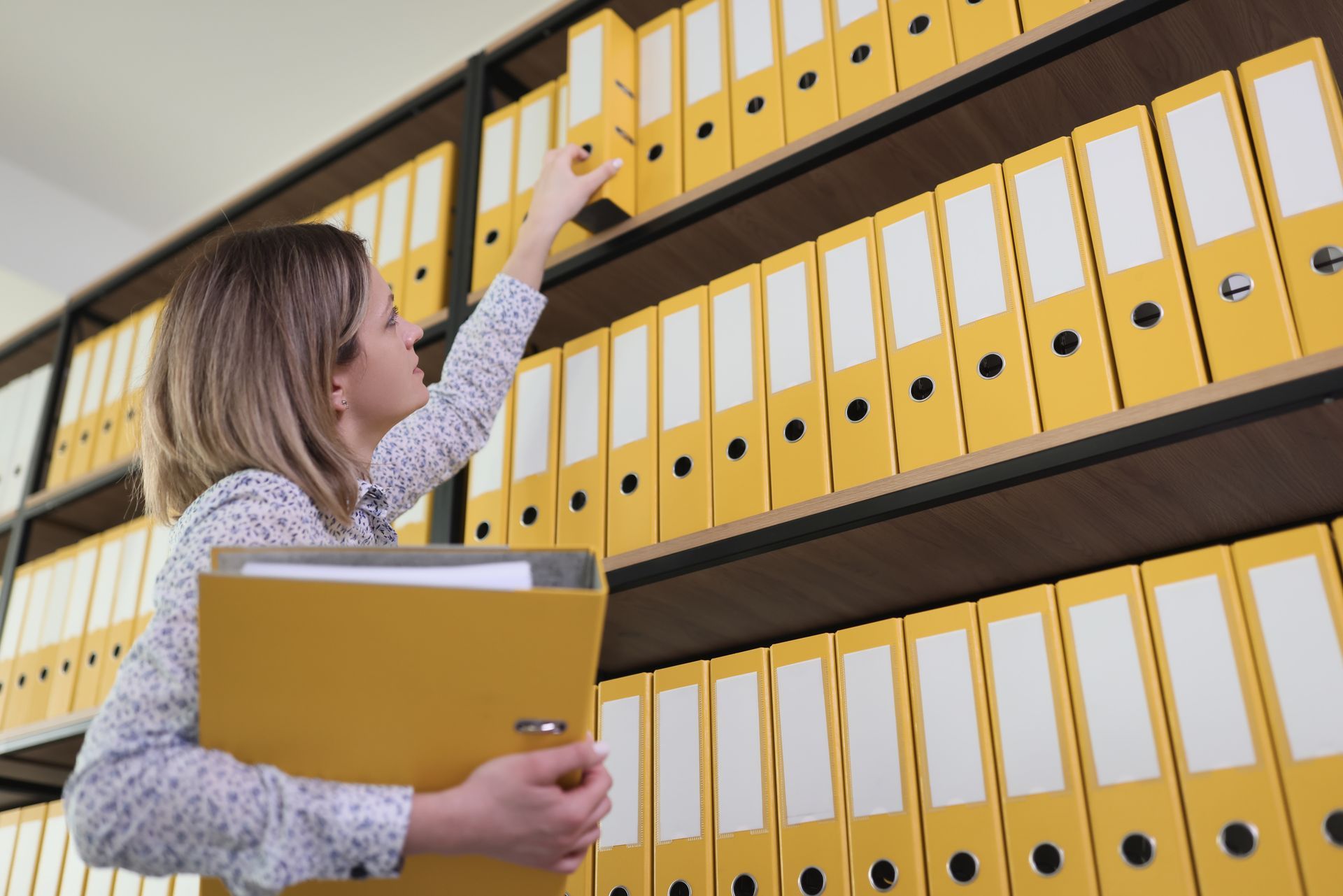 Staffing coordinator reviewing workforce plans in a modern workplace