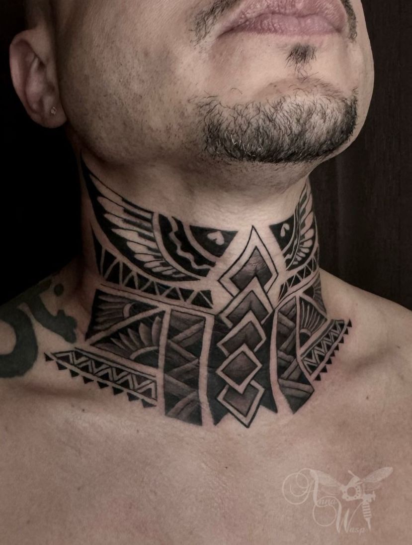 Man with a neck tattoo; geometric black tribal design around the neck.