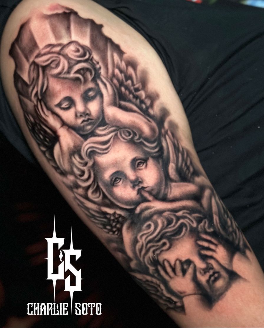 Tattoo of three cherubic angels on arm: Hear no evil, see no evil, speak no evil.