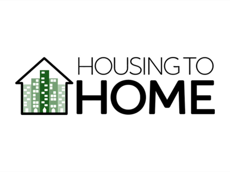 A logo for housing to home with a house and buildings in the background.