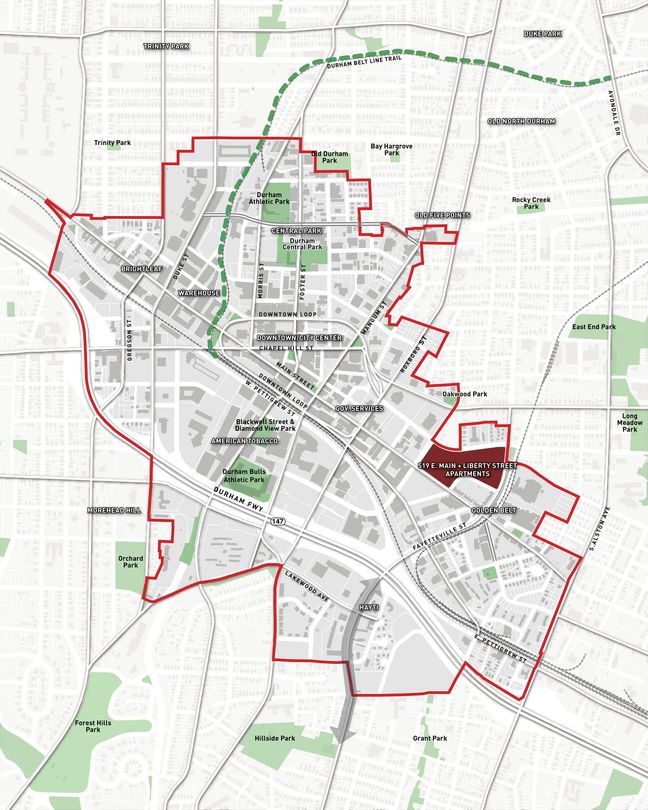 A map of a city with a red border and a green line.