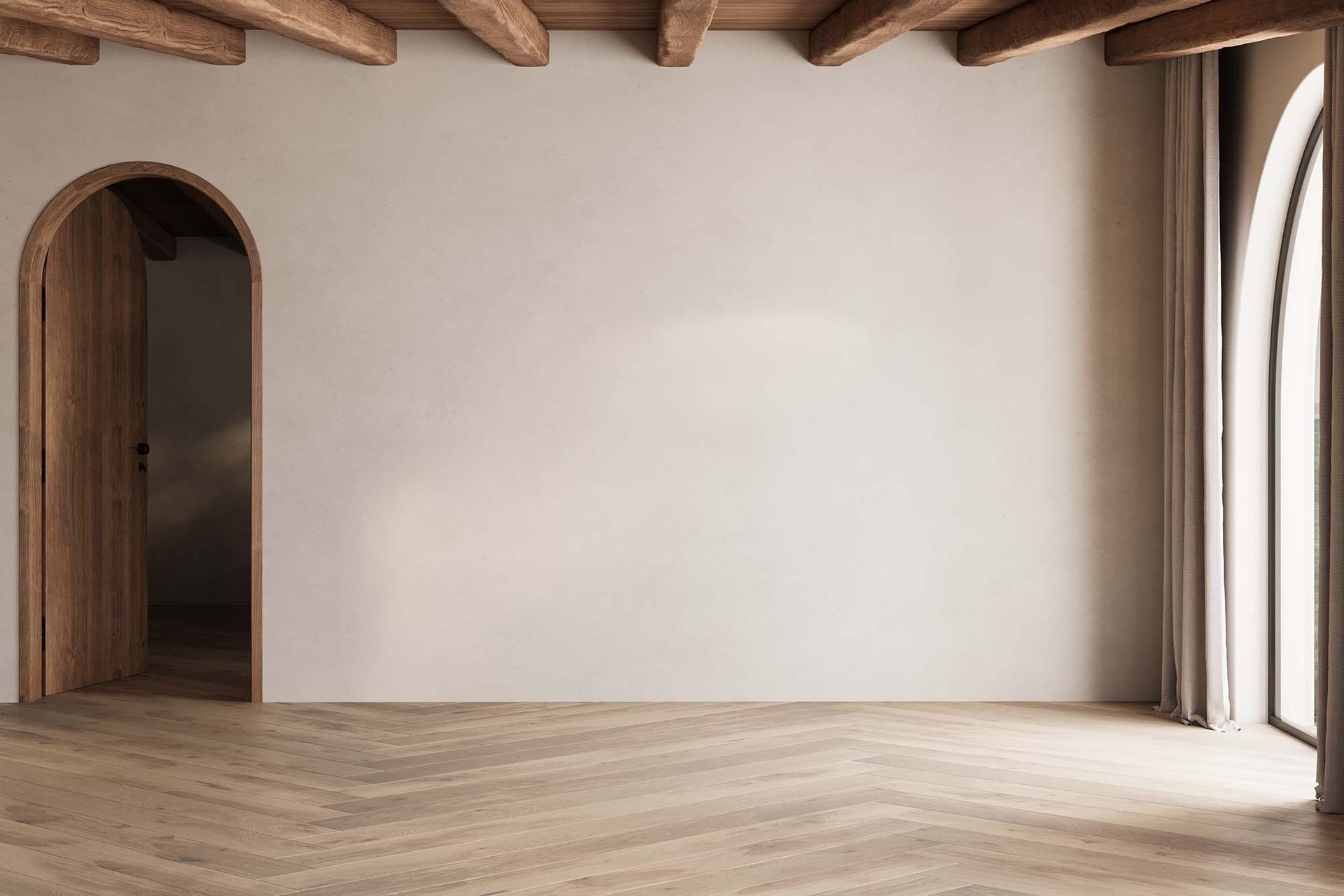 Minimalist empty room with white walls, wood floors, exposed beams, arched doorway, and tall windows