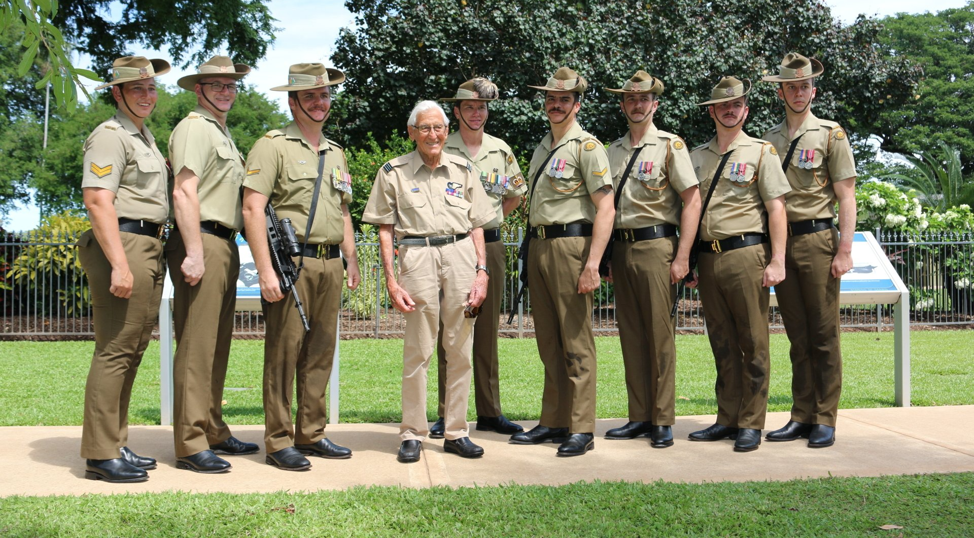 A group of men in military uniforms are posing for a picture