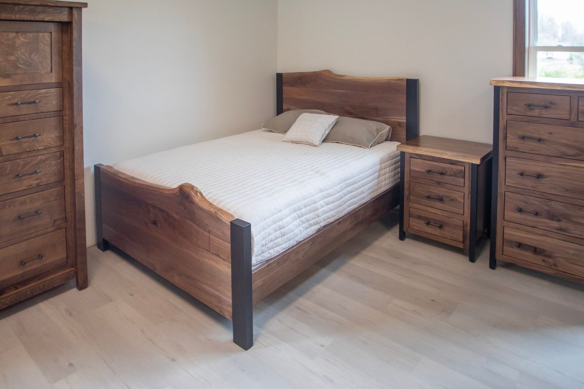 Bedroom furniture set with bed, nightstand, and dresser; wood with live edges.