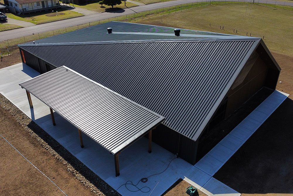 Scenic Aerial Perspective of Residence Featuring a Stylish Black Roof — Colorbond Roofing in Newcastle, NSW