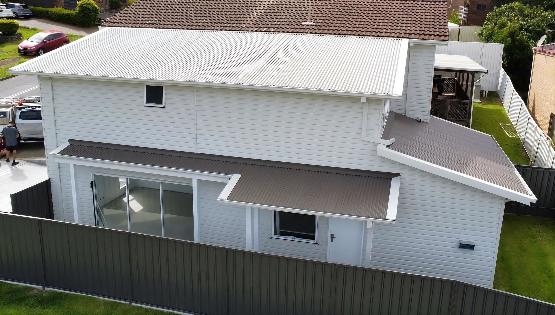Gray Corrugated Metal Roof on a House — Roofing in Newcastle, NSW