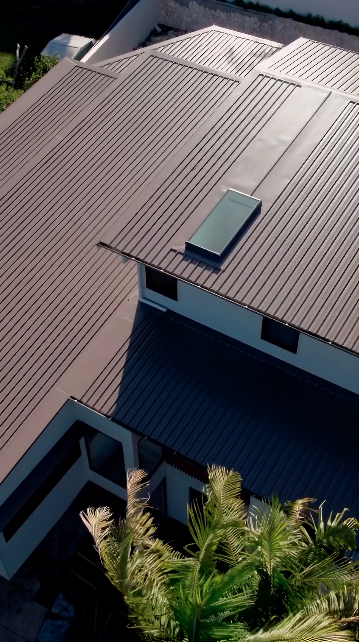 Dark Gray Building with a White Corrugated Metal Roof — Roofing in Newcastle, NSW