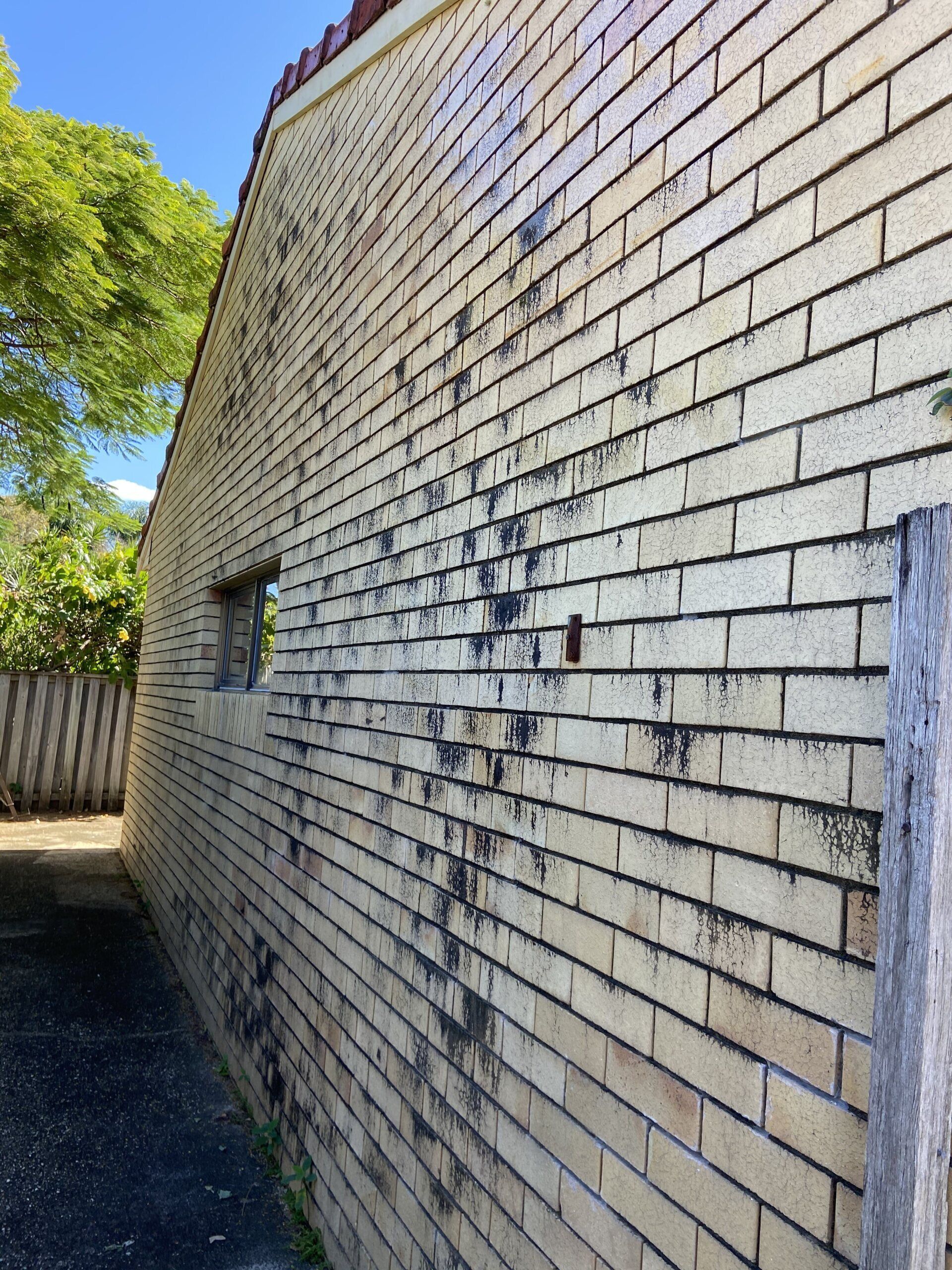 an image of a dirty brick wall