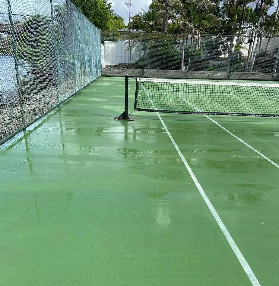 an image of a clean tennis court after a great job by our pressure cleaning business