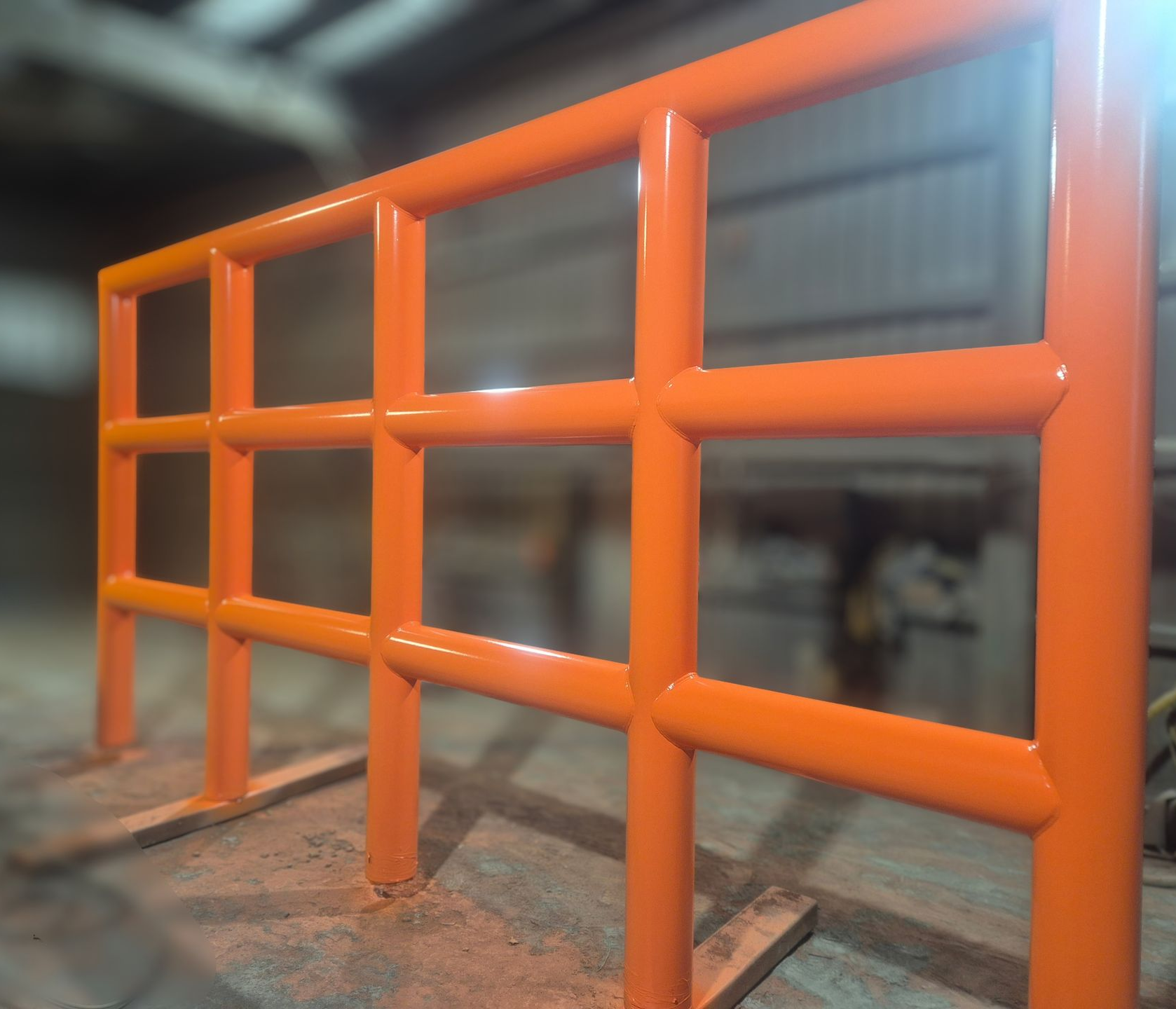 Orange metal safety railing in an indoor industrial setting — Sirocco Industrial in Pinelands, NT