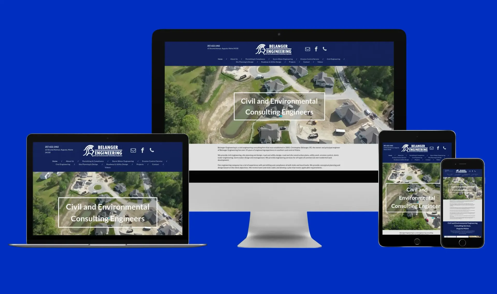 A computer , laptop , tablet , and cell phone displaying a website for a construction company.