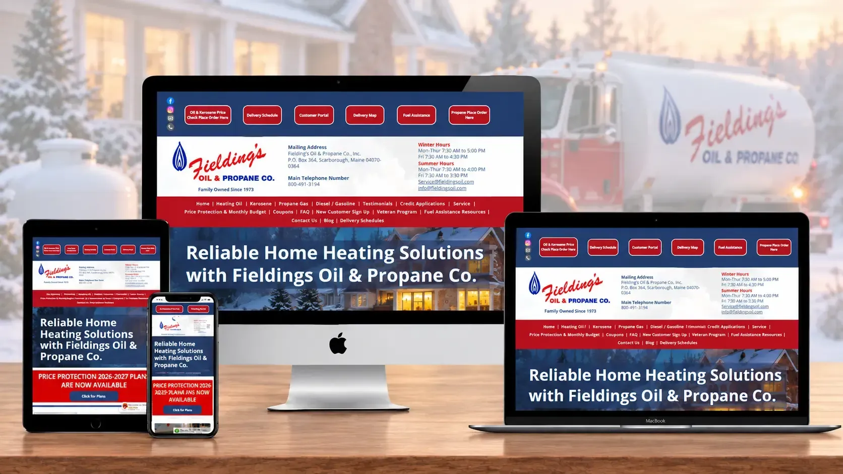 Desktop, laptop, tablet and phone showing a red-white heating service website on a snowy background