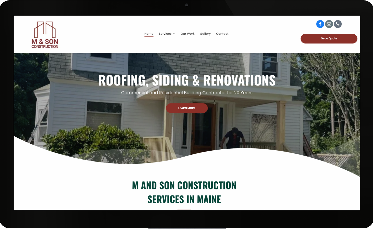 A computer screen shows a website for roofing , siding and renovations.