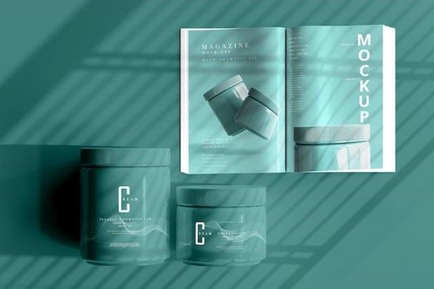 A mockup of a book and two jars on a green background.