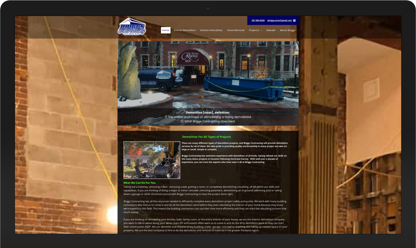 A computer screen shows a website for a construction company