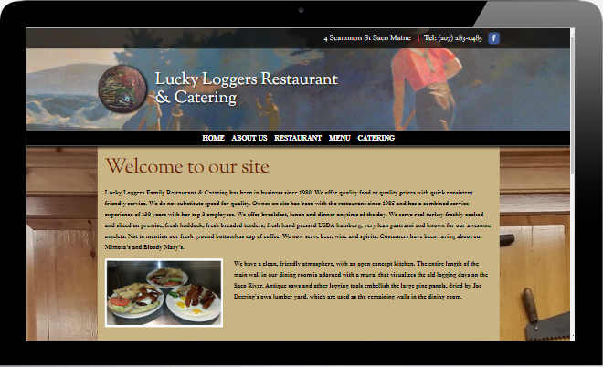 A computer screen shows the website for luckyloggers restaurant and catering