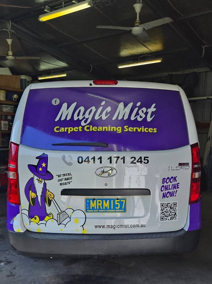 White Van Parked in Front of a Blue Building — Magic Mist Carpet Cleaning in Rockhampton City, QLD