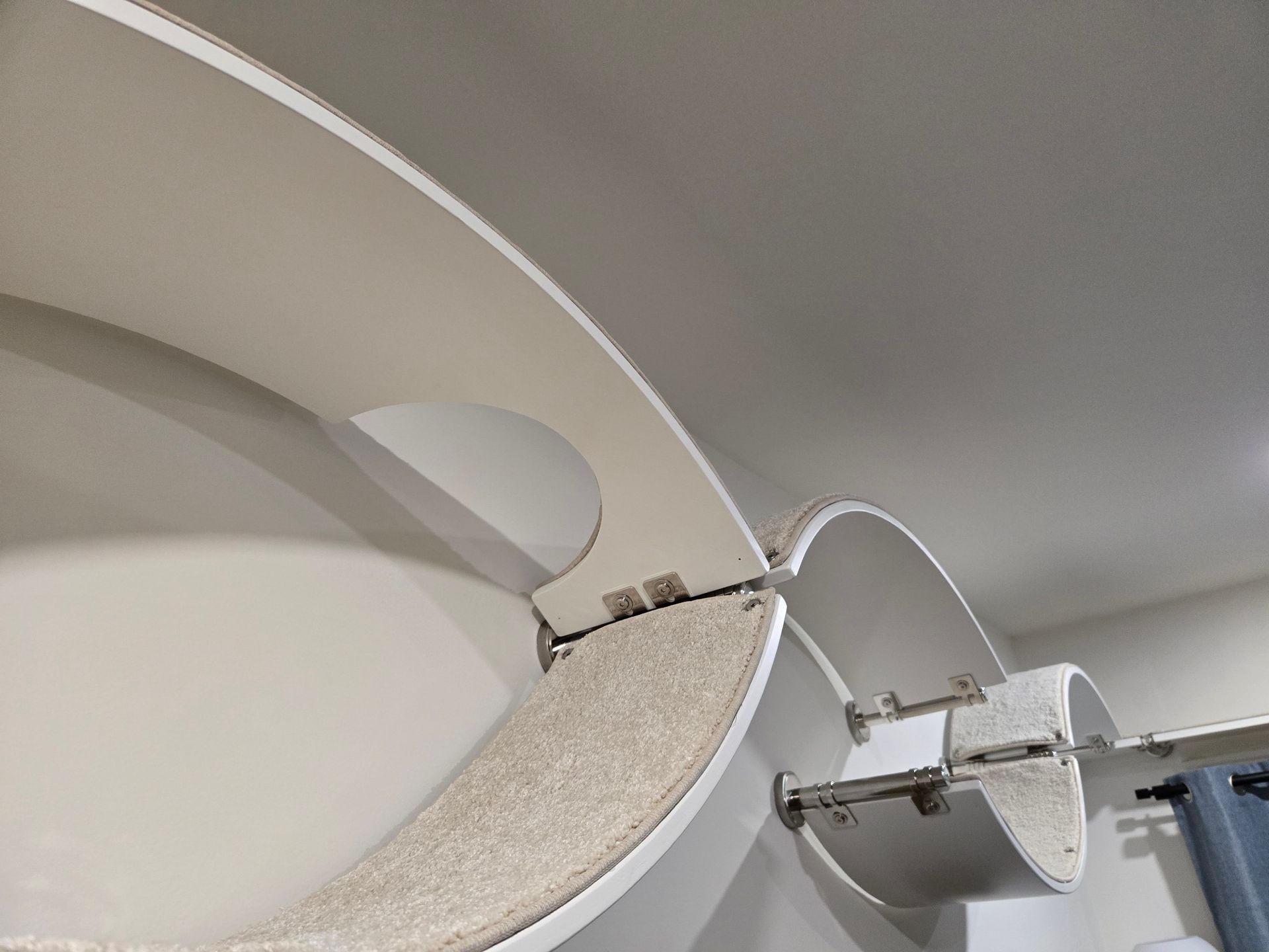 Swan  3 piece wall-mounted  modular carpeted curved shelf system featuring  in a balanced, double-wave configuration.
