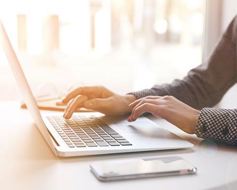lady typing on a computer