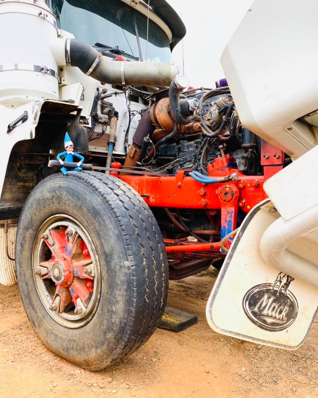 Mack Truck Engine, Open Hood, Tire in Front — Traction Diesel Services in Clermont, QLD