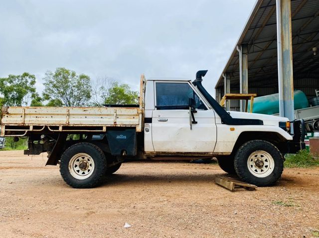 White Pickup Truck With a Flatbed and Snorkel Parked Outdoors — Traction Diesel Services in Clermont, QLD