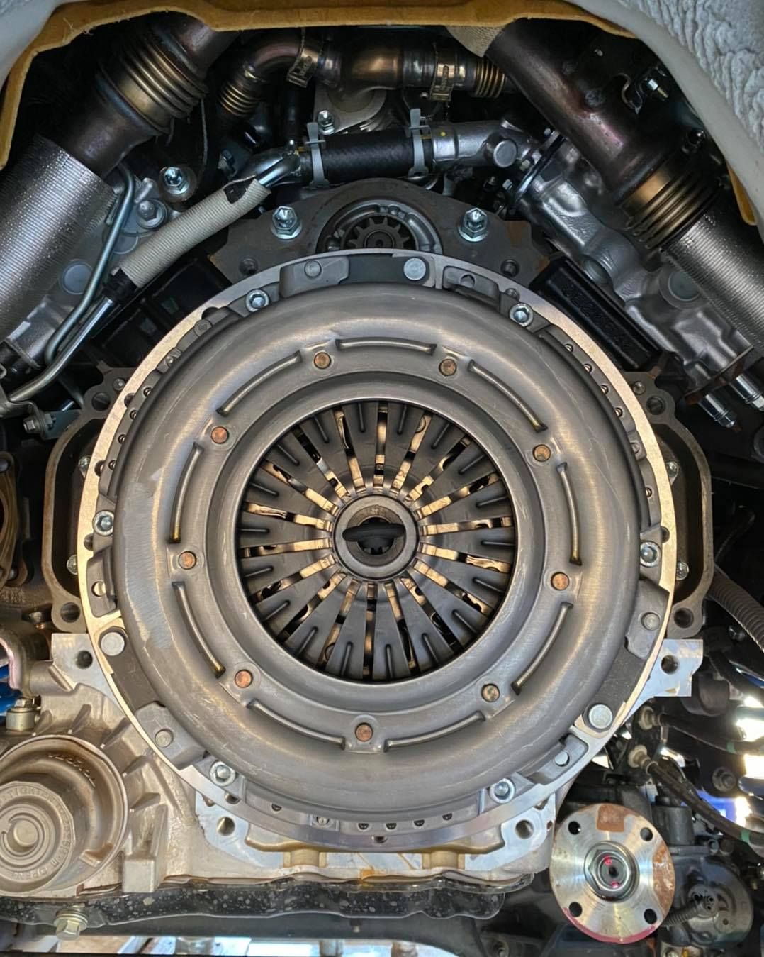 Car Engine, Close-up View Clutch Assembly Visible at Center — Traction Diesel Services in Clermont, QLD