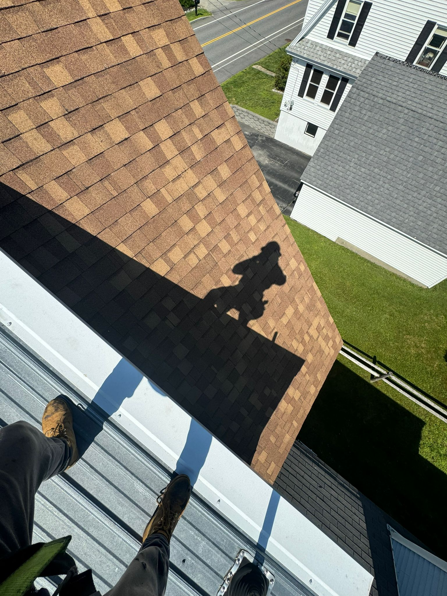 finished asphalt shingle roof install in maine