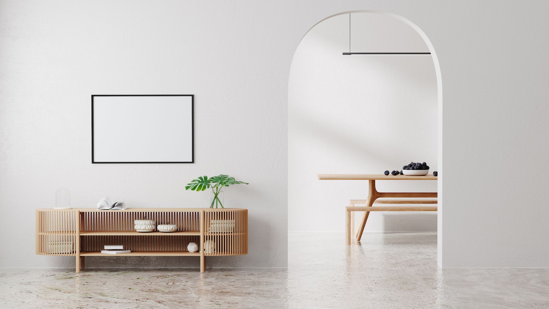 Minimalist living room with wooden sideboard, archway to dining area, and framed art.
