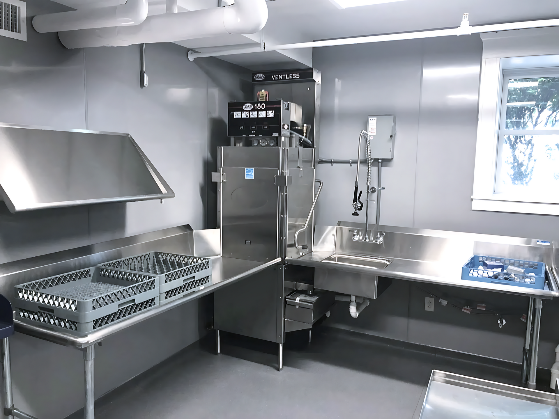 a kitchen with a dishwasher in the corner