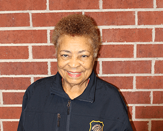 A picture of Commissioner Vester Melancon wearing a jacket with a HCESD25 logo patch.
