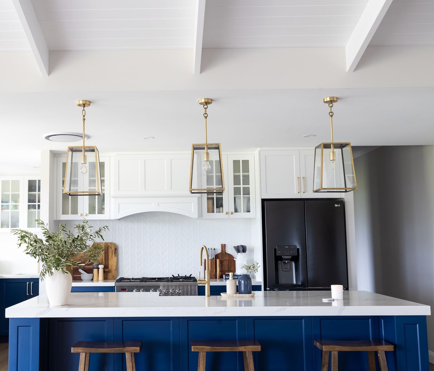 A Kitchen With White Cabinets and a Black Counter Top — Truline Cabinets In Tuchekoi, QLD