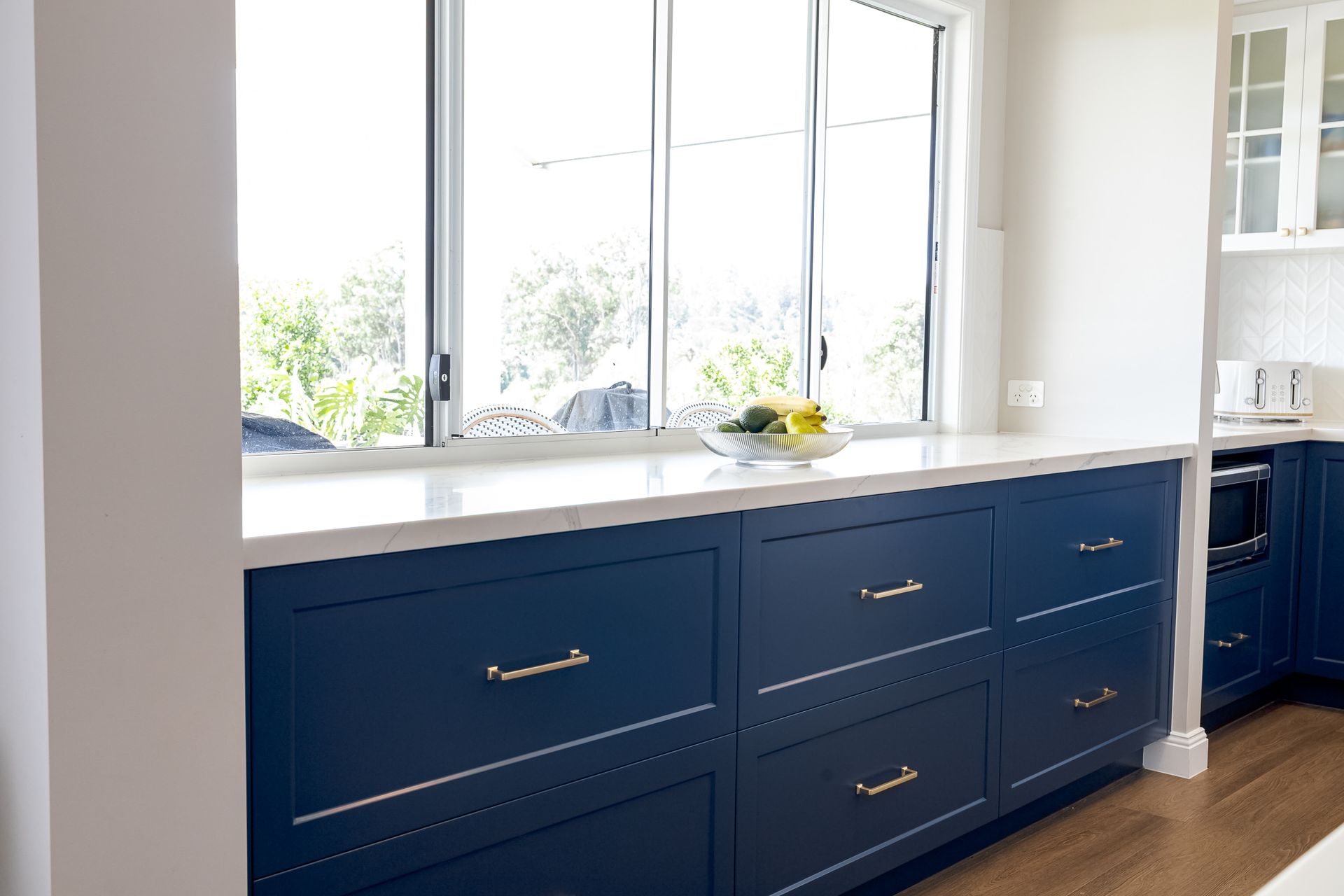Blue Kitchen Cabients with White Tabletop — Truline Cabinets In Buderim, QLD