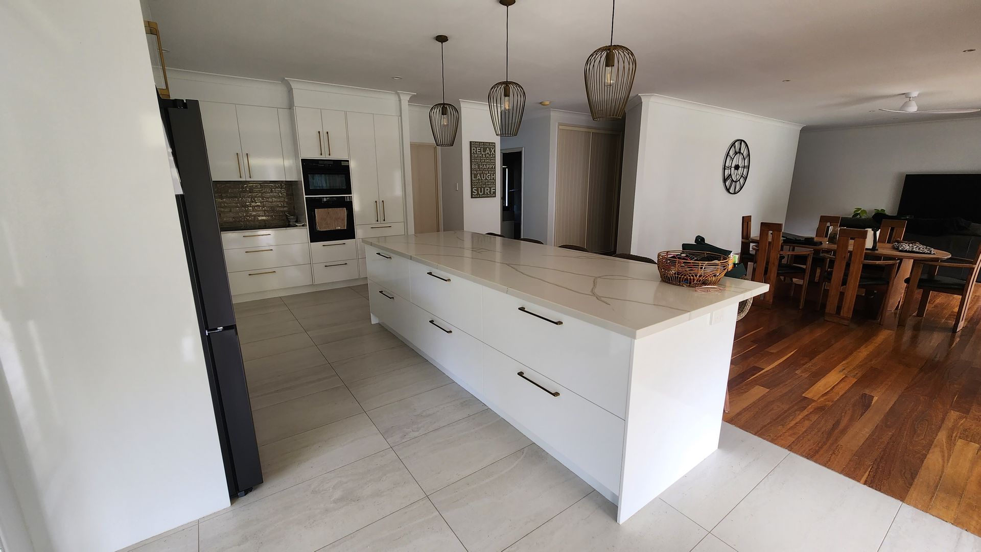 A Kitchen With White Cabinets and Marble Top — Truline Cabinets In Tuchekoi, QLD