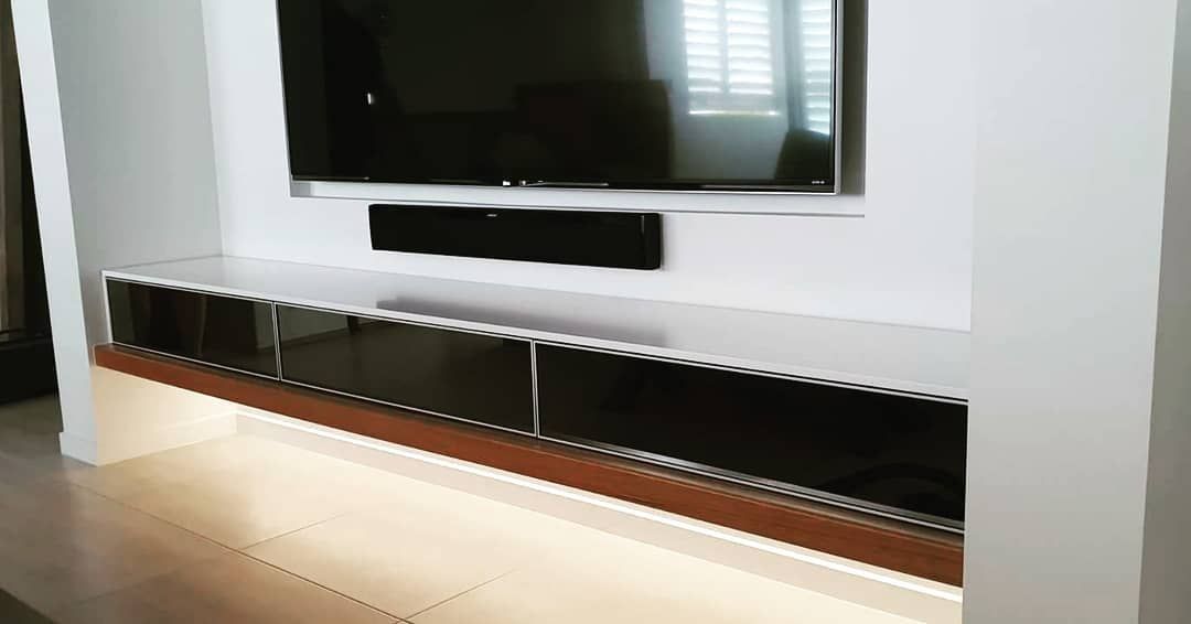 A Sony Television is Sitting on a Wooden Table — Truline Cabinets In Tuchekoi, QLD