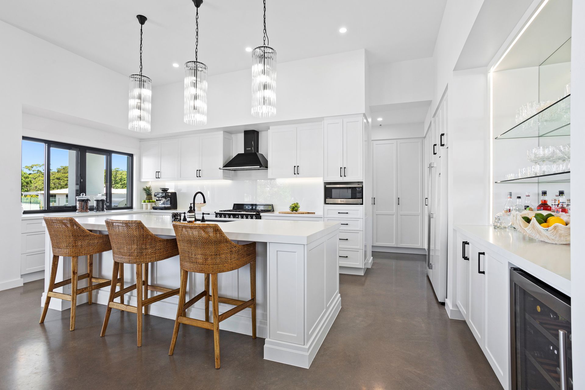 A Kitchen With Stainless Steel Appliances and White Cabinets — Truline Cabinets In Tuchekoi, QLD