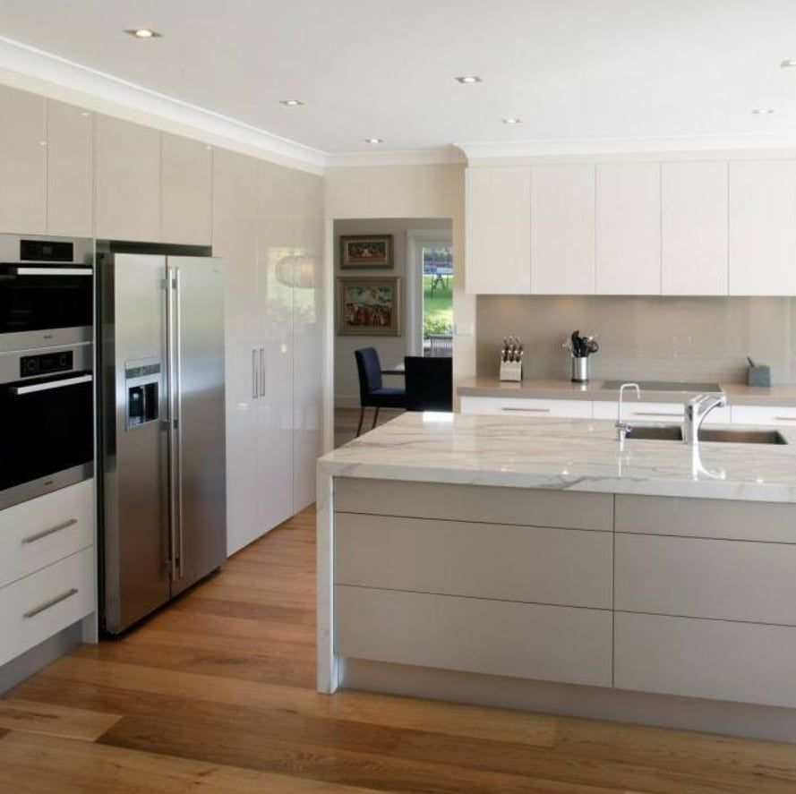 A Kitchen With Stainless Steel Appliances and White Cabinets — Truline Cabinets In Buderim, QLD